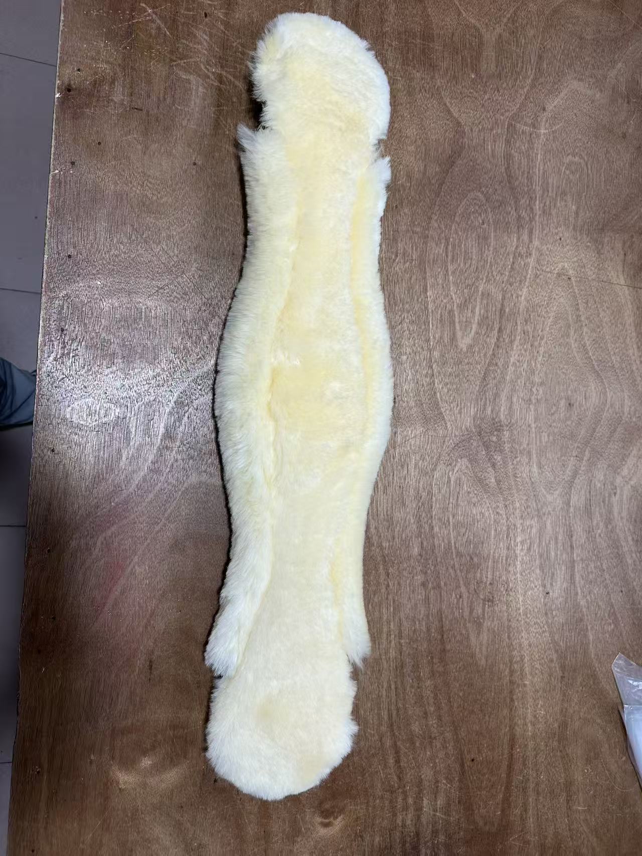 Underside: sheepskin coverage across the contoured body.
